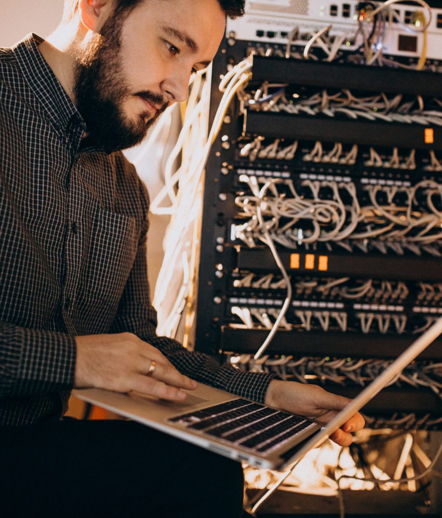 Young it service man repairing computer